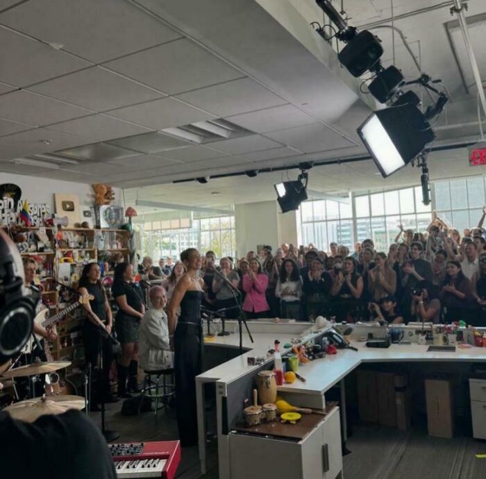 Live music performance setting with an enthusiastic audience, showcasing a new perspective on famous events.