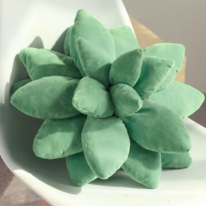 Green succulent-shaped pillow on a chair, a show-stopping find.