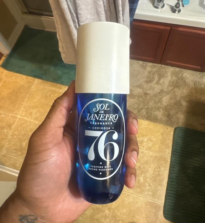 A hand holding a Sol de Janeiro Cheirosa 76 fragrance mist, a show-stopping find.