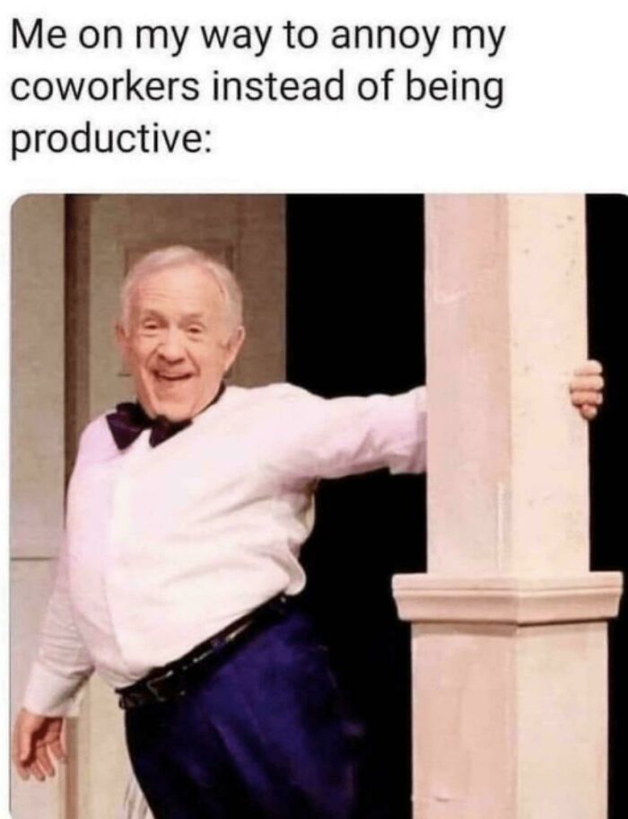 Man in a playful pose next to a pillar with a caption about work memes and productivity.