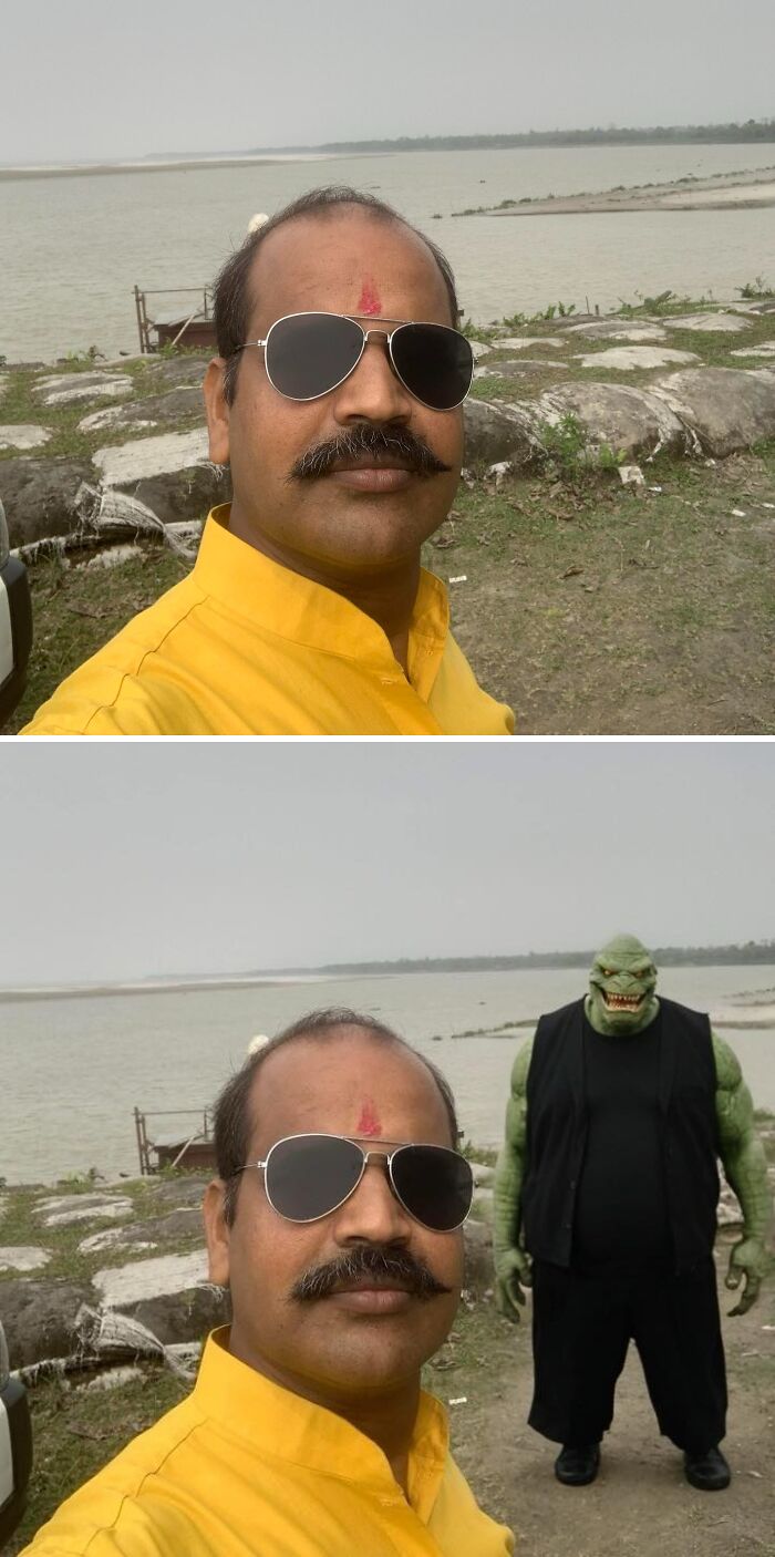 Man in sunglasses taking a selfie by a river, with a funny edited creature in the background.