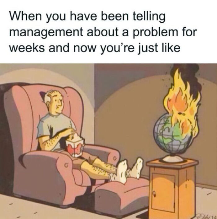 Person relaxing with popcorn as a globe burns, illustrating a funny work meme.