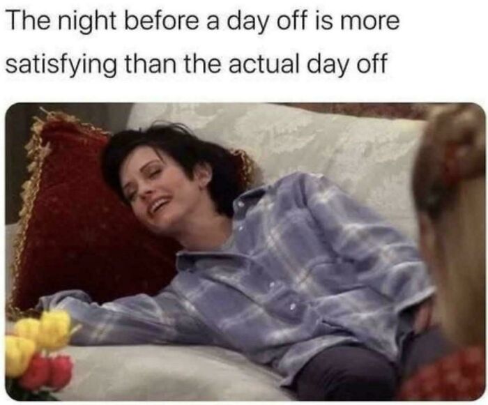 Woman in plaid shirt relaxing on a couch, embodies funniest work meme about enjoying the night before a day off.