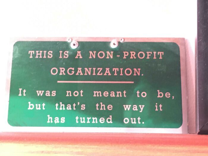 "Humorous sign about a non-profit organization with unintended results."