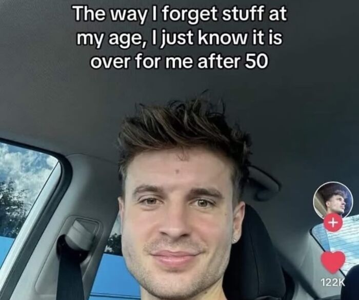 Man sitting in a car with a relatable meme about memory loss at a young age.