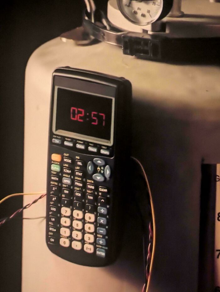 Creative filmmaking prop with calculator timer mounted on equipment.