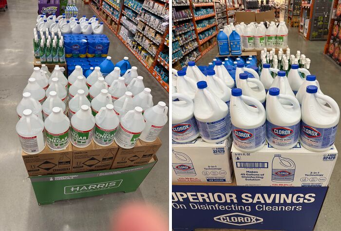 Dangerous display of cleaning products, including vinegar and bleach, in a store aisle.