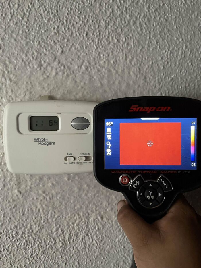 Thermostat and thermal imager showing temperature discrepancy, highlighting landlord issues.
