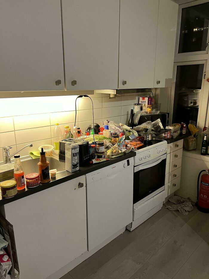 Messy kitchen countertop crowded with food and clutter, illustrating a common tenant frustration with landlords.