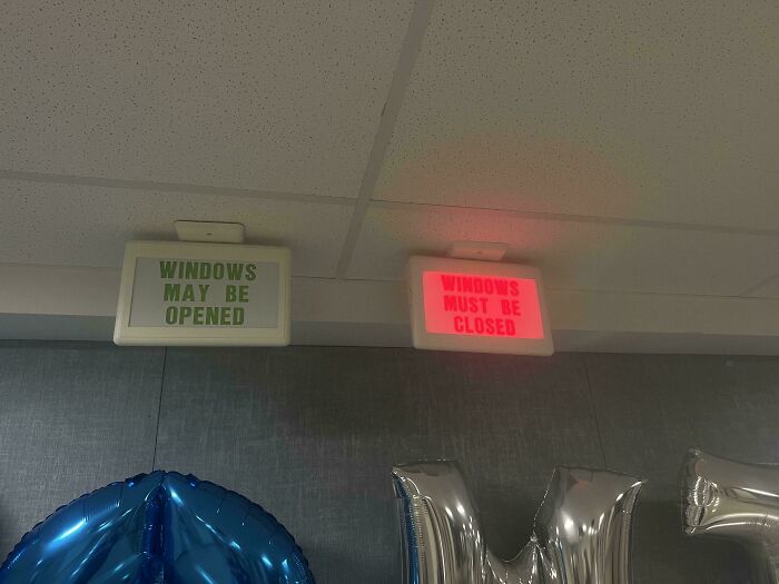 School signs indicating windows may be opened or must be closed.