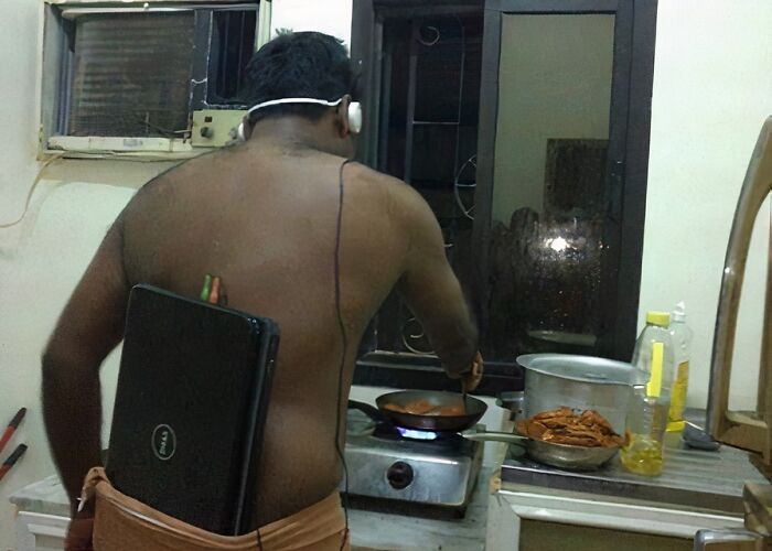 Man cooking shirtless in a kitchen, wearing headphones with a laptop strapped to his back, depicting random cursed images.