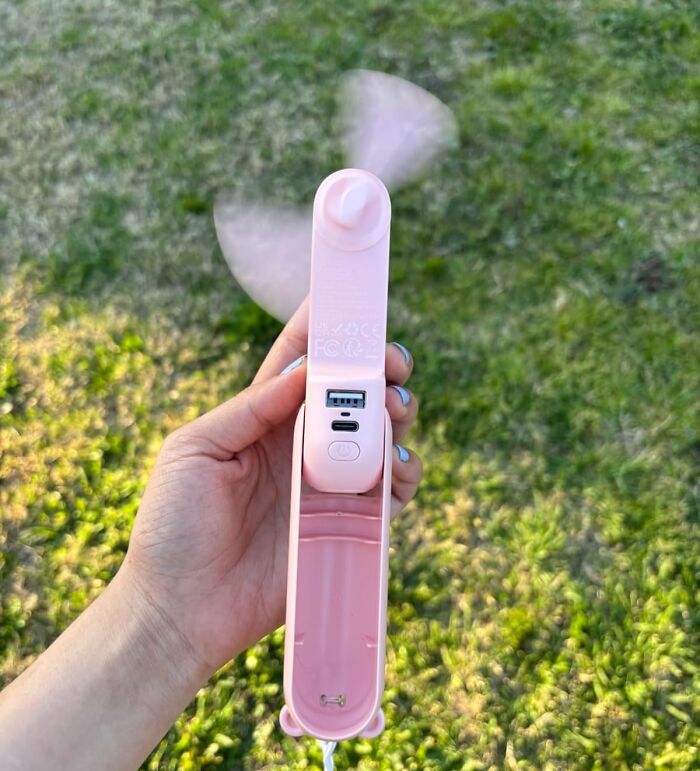 Hand holding portable pink USB fan, one of the featured Amazon products in 40K Review Club.