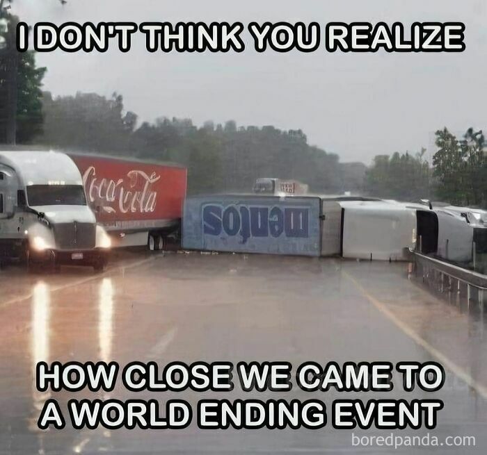 Trucks with Coca-Cola and Mentos logos on a wet road, emphasizing sarcasm about a near disaster.