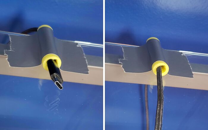 Failed repair attempt using tape to hold cables on a desk.