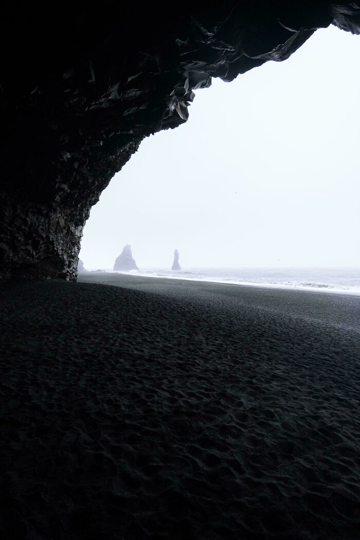 Coastal cave view with rock formations in the ocean, showcasing a beautiful place discovered.
