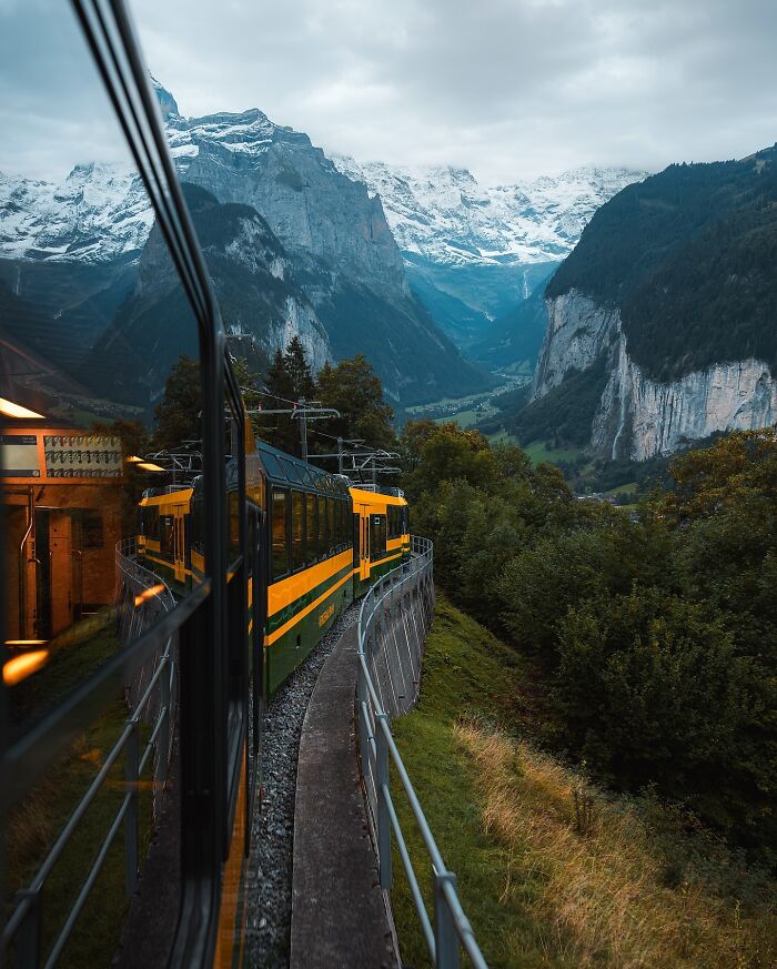 Train travels through scenic mountains and valleys, showcasing one of the most beautiful places discovered.