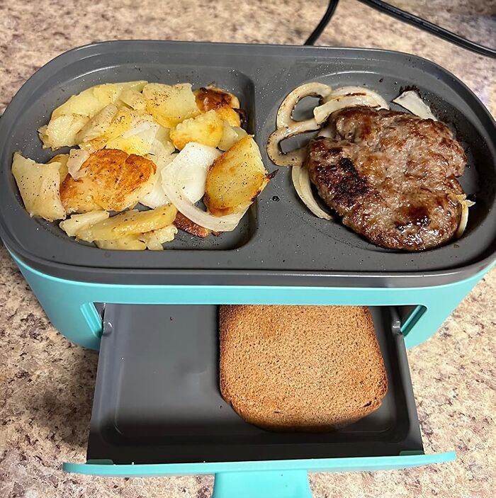 Compact kitchen gadget with dual cooking trays for toast, potatoes, and burger patty.