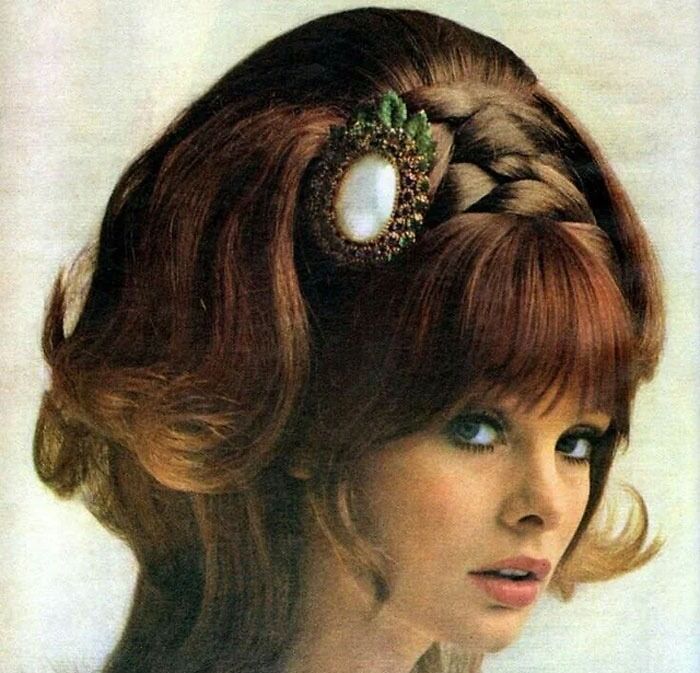 Vintage hairstyle with intricate braid and ornate accessory from yesteryear, showcasing bold and creative hair fashion.