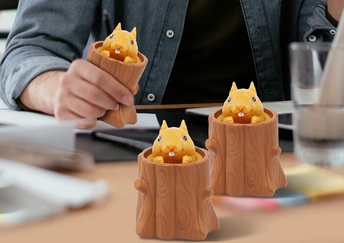 Cute work supplies featuring playful animal figures in wooden cups on a desk for a fun Monday mood.