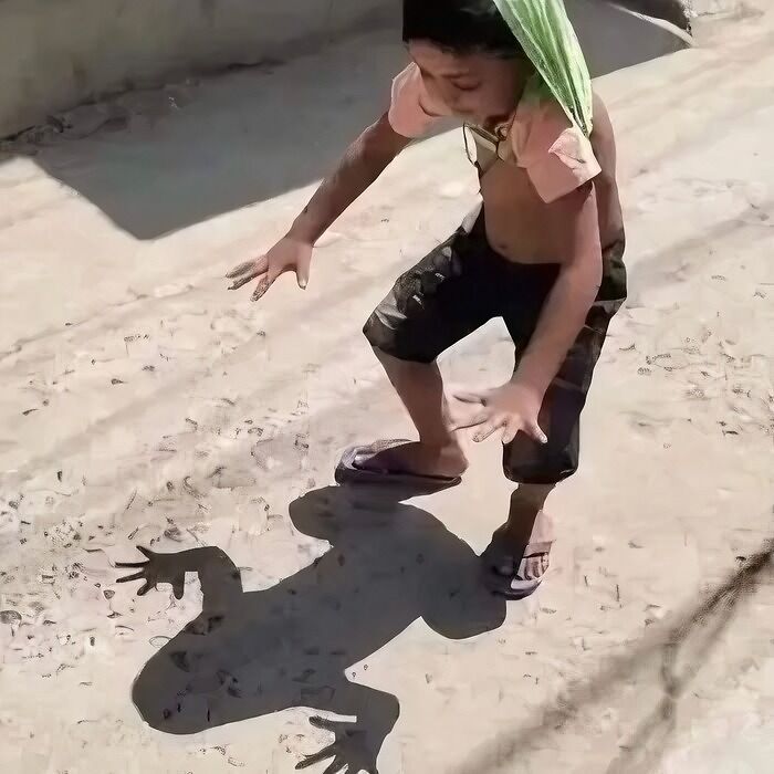 Child amazed by shadow resembling a monster, captured in a humorous Instagram image.