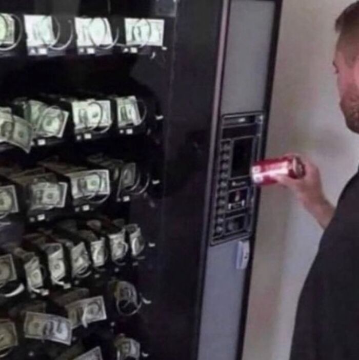 A vending machine filled with money as a man holds a soda can, showcasing a funny random image.