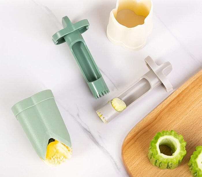 Innovative kitchen tool for easy fruit and vegetable coring on a marble surface.