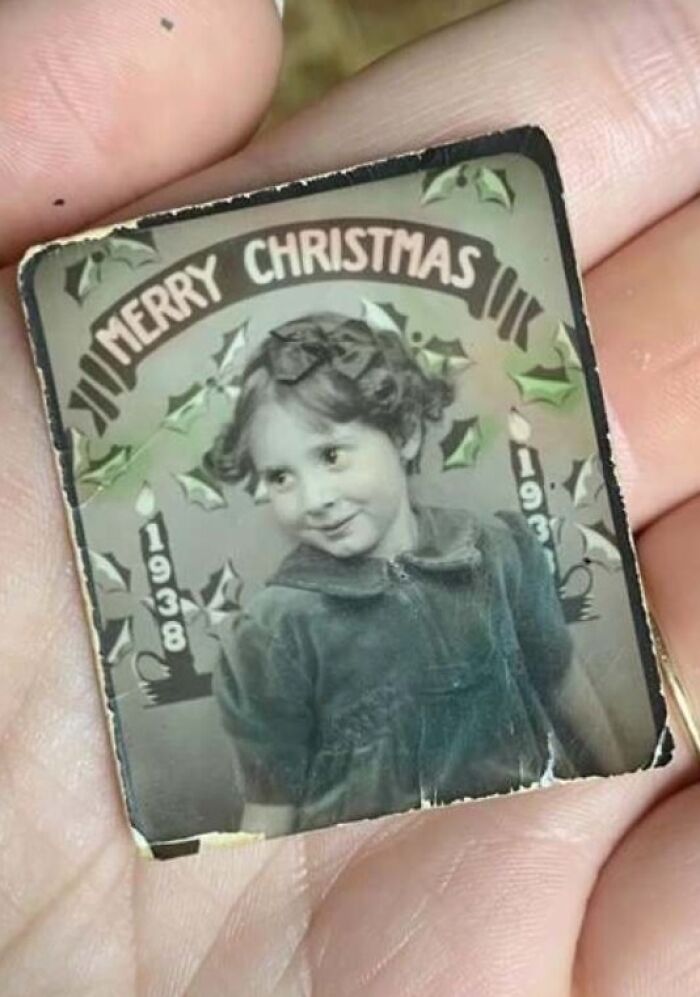 Vintage Christmas photo from 1938 held in hand, showcasing a fascinating old image from history.