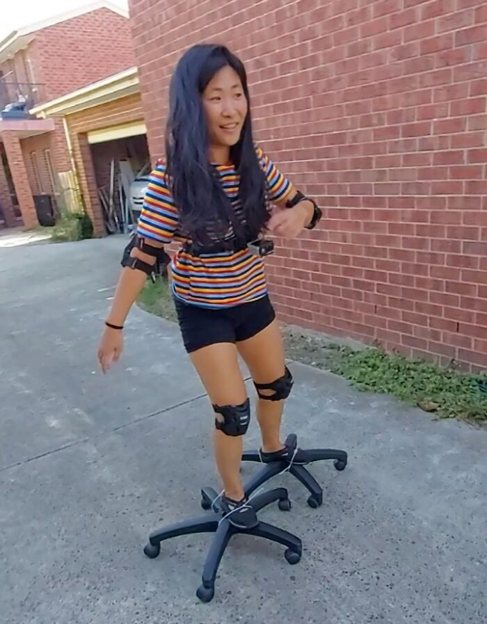 Person attempting repair on office chair wheels for skates fails humorously.