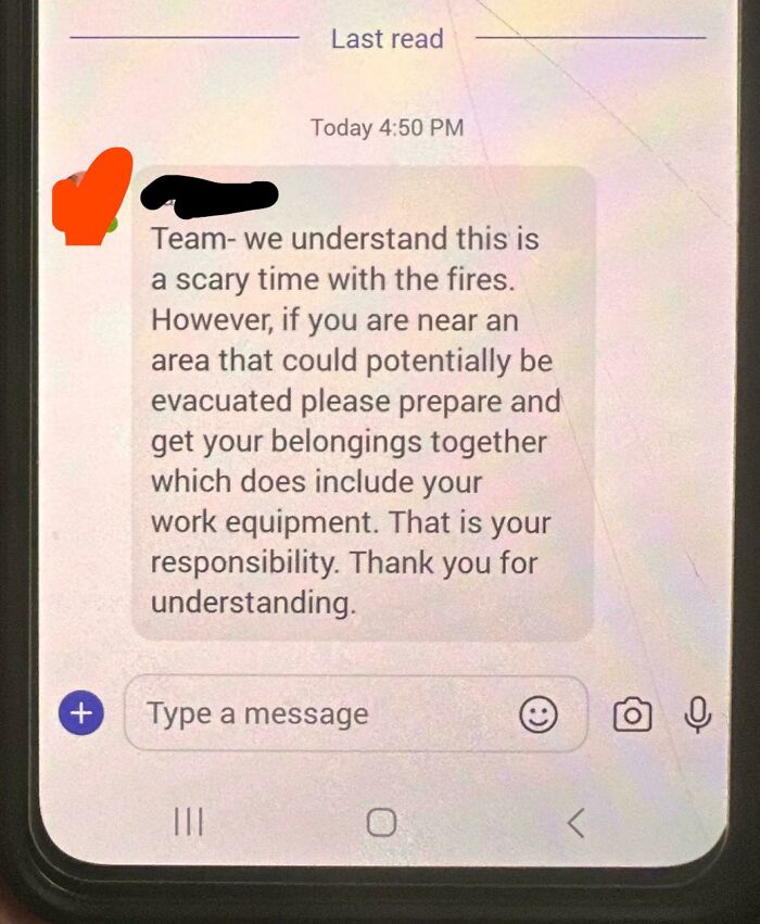 Text message instructing a team to prepare for possible evacuation due to fires.