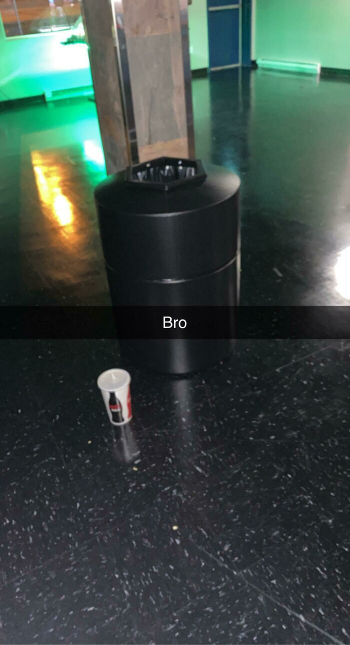 Trash can with a cup on the floor next to it, expressing online frustration.