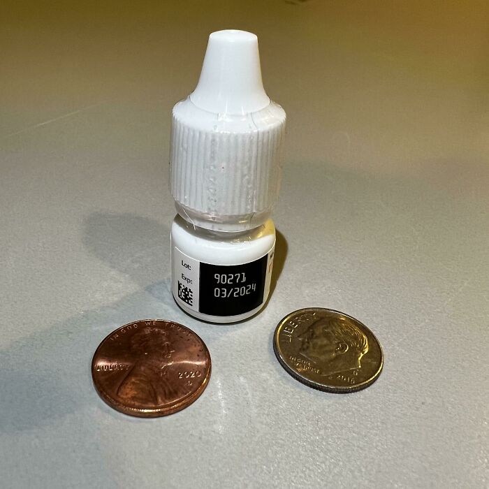 Small bottle and two coins showcase a product expiration date, reflecting online frustration over product size versus price.