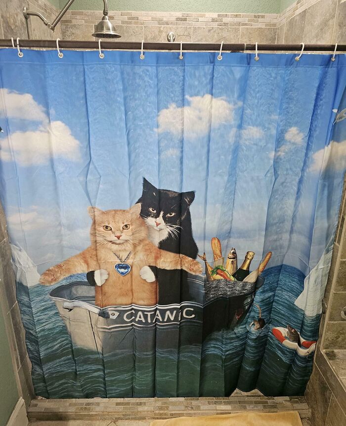 Funny shower curtain with two cats on the "Catantic" boat, wearing jewelry and surrounded by champagne and fish.