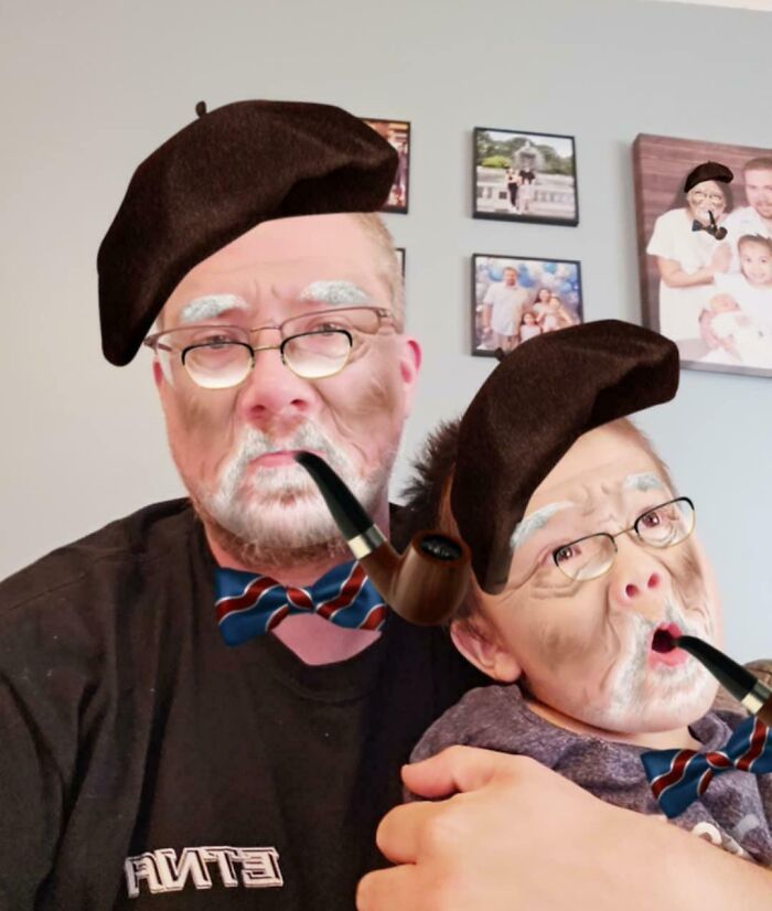 Man and child with face filters, wearing berets and pipes, creating a humorous scene to ensure life is never boring.