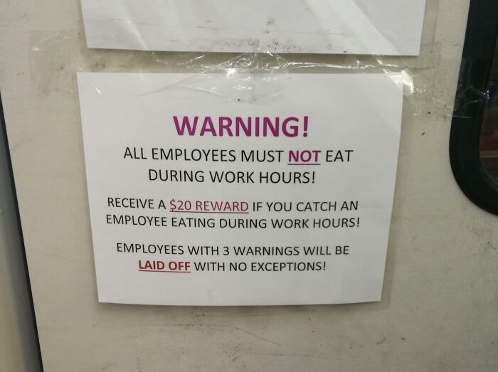 Sign warning employees not to eat during work hours, offering a reward and threat of layoff, showcasing infuriating bosses.
