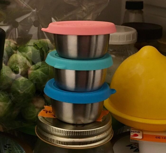 Stacked containers in fridge, enhancing meal prep efficiency.