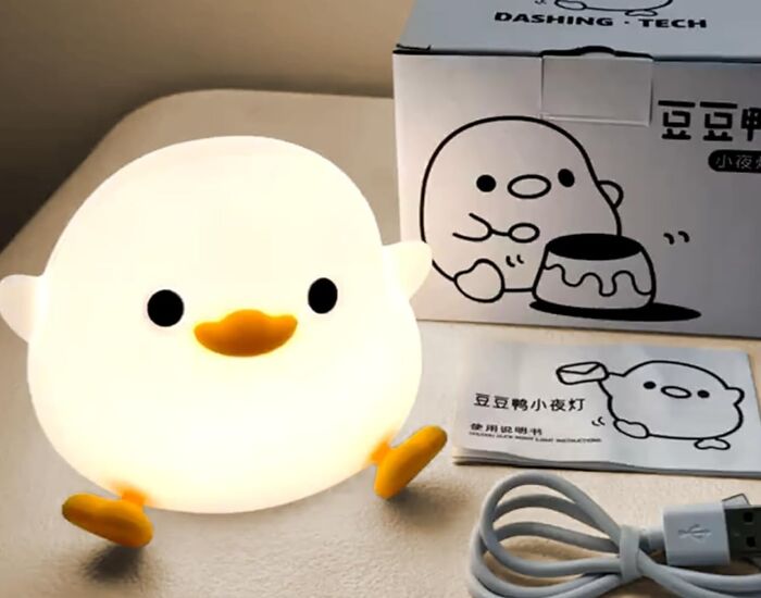 Cute chick night light, perfect Easter basket treat, with packaging and USB cable on a table.