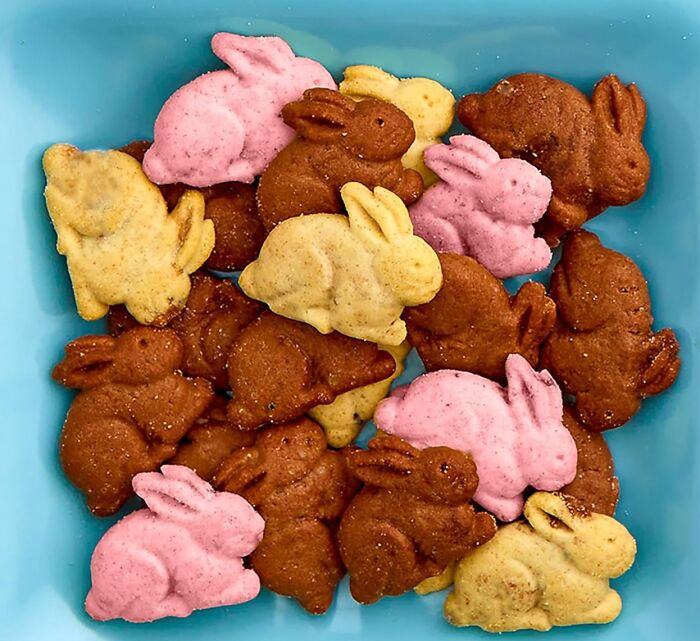 Colorful bunny-shaped treats, perfect for filling your own Easter basket, displayed in a blue dish.