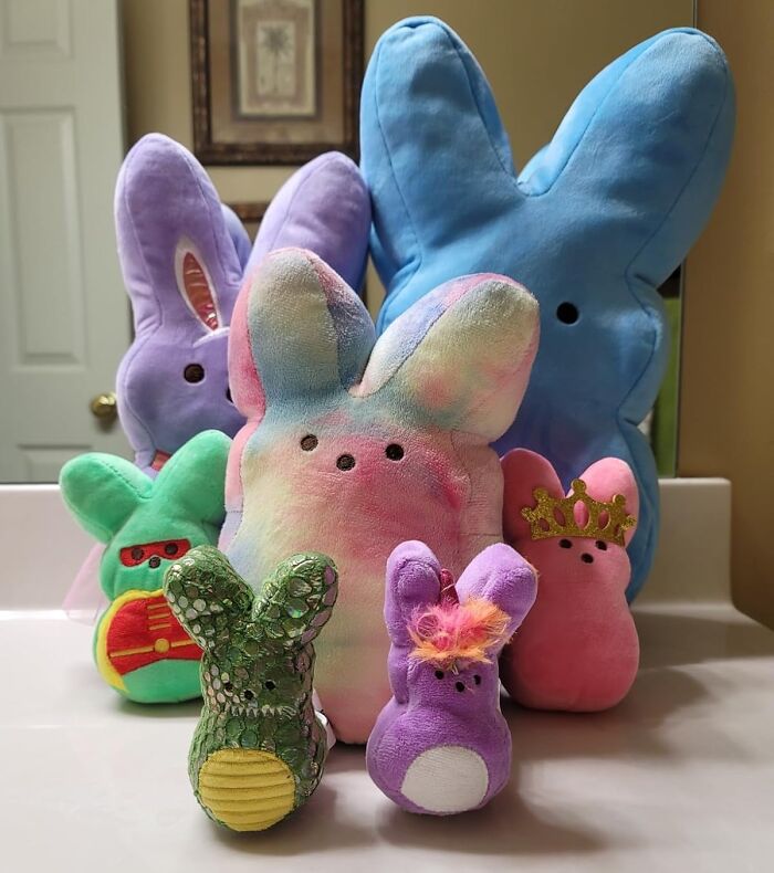 Colorful plush Easter bunny toys arranged on a counter, perfect for filling your own Easter basket.