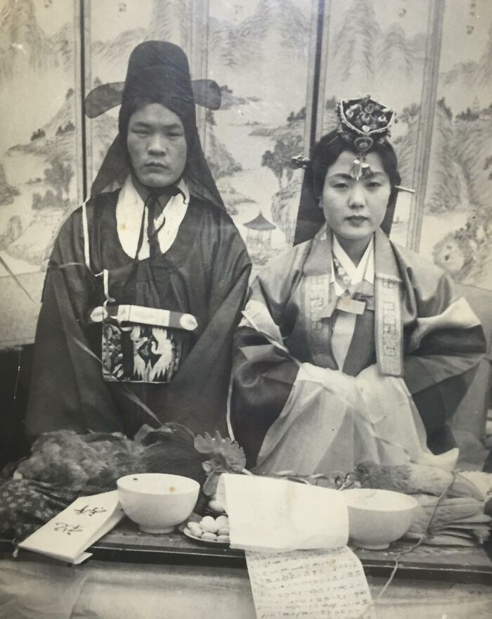 Vintage wedding photo of a couple in traditional attire, symbolizing timeless love.