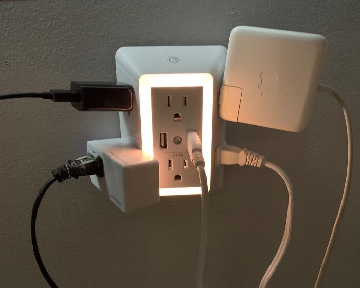 Smart home product: Illuminated wall outlet with multiple plugs and USB ports, enhancing functionality affordably.