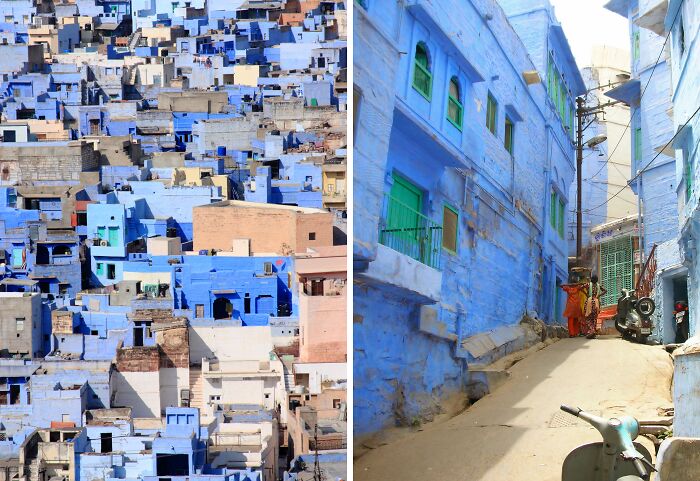 Colorful cityscape of blue buildings with narrow alley, resembling a real-life painting.