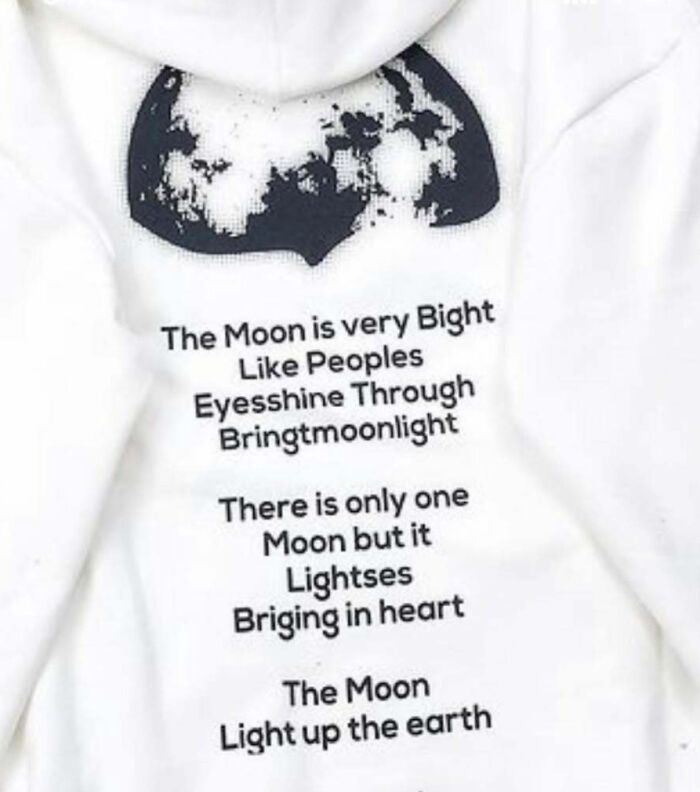 T-shirt with humorous translation about the moon and light, featuring creative spelling errors.