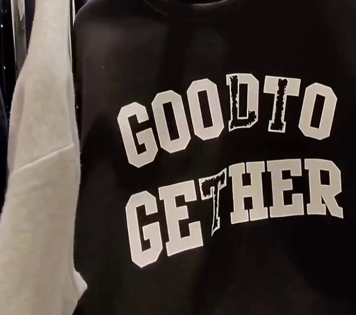 Black shirt with a poorly translated phrase in white text reading "GOODTO GETHER," found in Japan.
