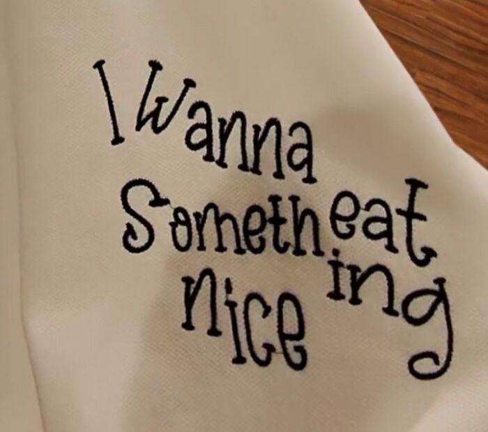 Poorly translated shirt found in Japan displaying the text "I Wanna Someth eat ing Nice" in playful font.