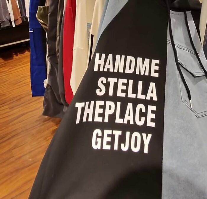 Shirt with text "HANDME STELLA THEPLACE GETJOY" in bold letters, part of poorly translated shirts in Japan collection.