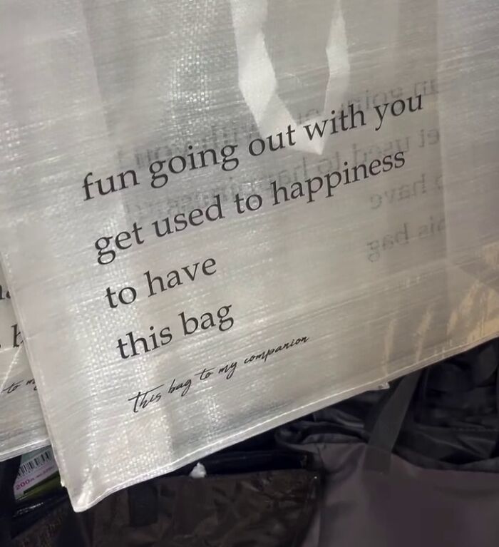 Poorly translated bag text in Japan: "fun going out with you, get used to happiness, to have this bag."