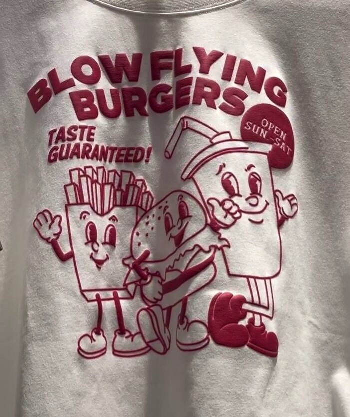 Cartoon burger, fries, and drink with "Blow Flying Burgers" text on a T-shirt; poorly translated shirt from Japan.