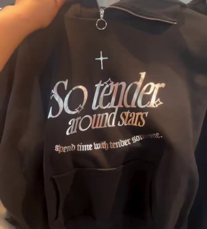 Black shirt with stylized text, "So tender around stars." Features unique translation design found in Japan.
