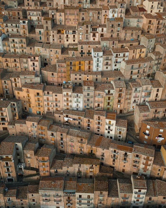 Aerial photo of densely packed, rustic buildings showcasing a unique world perspective.
