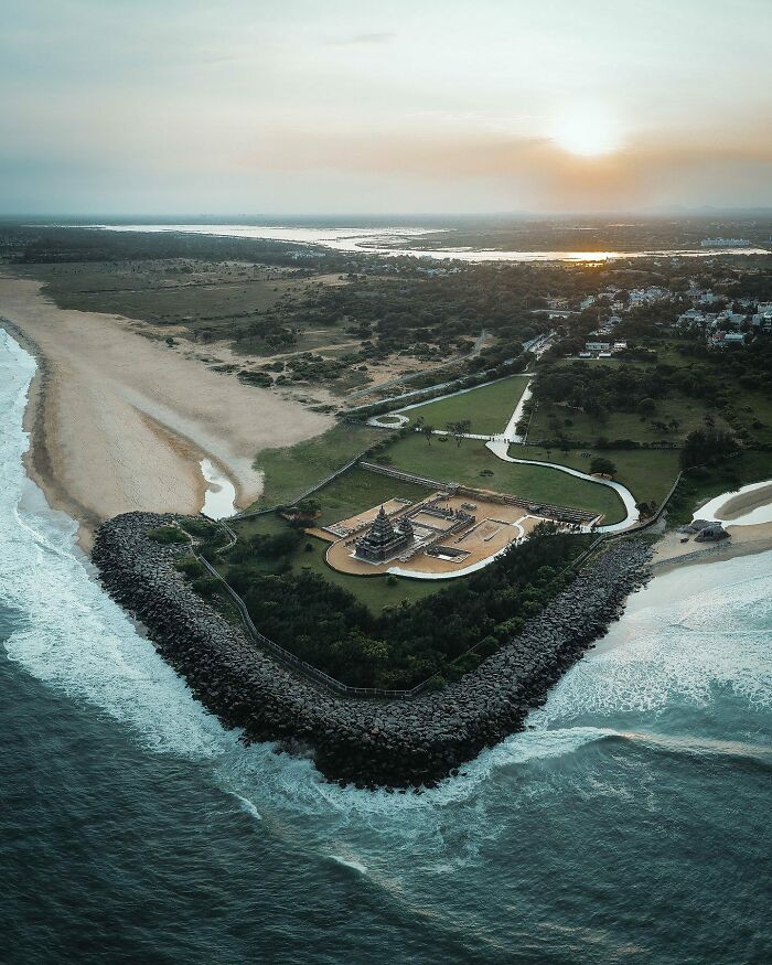 Aerial photo of a coastal landscape at sunset showcasing the world from a different angle.